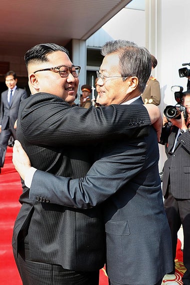 In this handout image provided by South Korean Presidential Blue House, South Korean President Moon Jae-in (R) hugs with North Korean leader Kim Jong Un (L) before their meeting on May 26, 2018 in Panmunjom, North Korea.